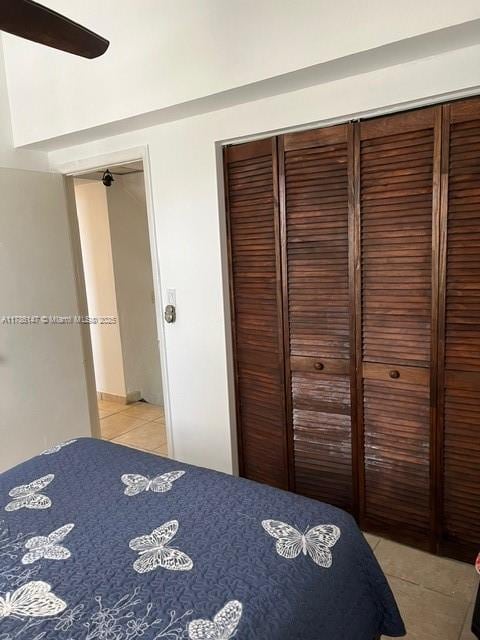 12045 SW 18th St Unit 1-42, Miami, FL 33175 - bedroom featuring light tile patterned floors, a closet, and a ceiling fan