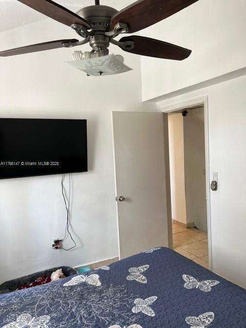 12045 SW 18th St Unit 1-42, Miami, FL 33175 - bedroom featuring light tile patterned floors and a ceiling fan