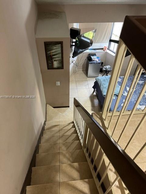 12045 SW 18th St Unit 1-42, Miami, FL 33175 - stairs featuring tile patterned flooring