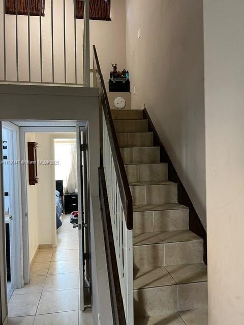 12045 SW 18th St Unit 1-42, Miami, FL 33175 - staircase featuring tile patterned flooring