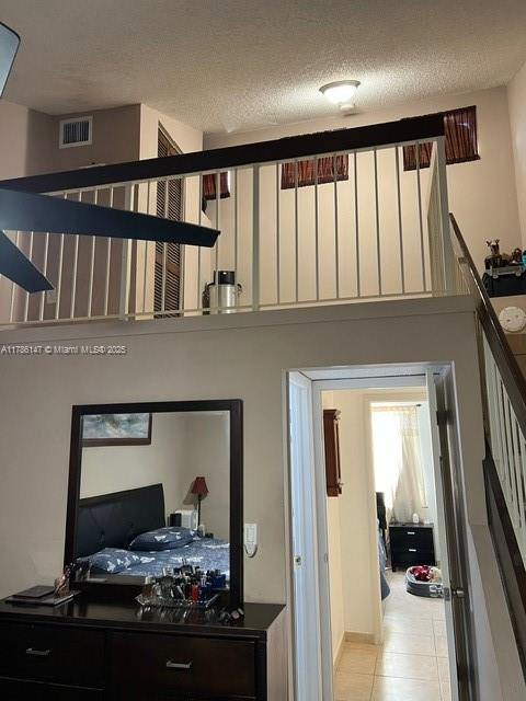 12045 SW 18th St Unit 1-42, Miami, FL 33175 - staircase with a textured ceiling