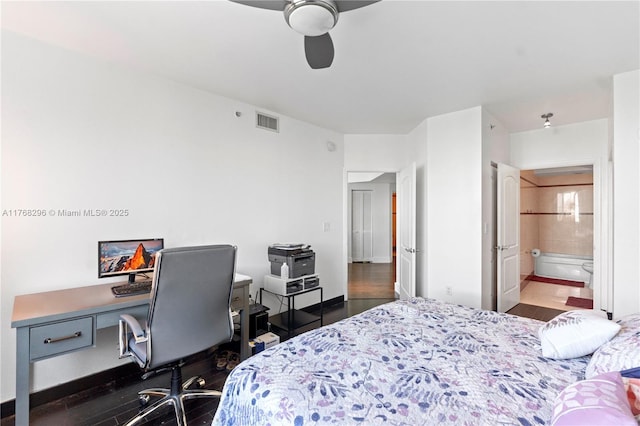 bedroom featuring wood finished floors, visible vents, ceiling fan, and connected bathroom
