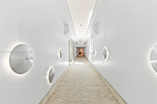 hallway with light speckled floor