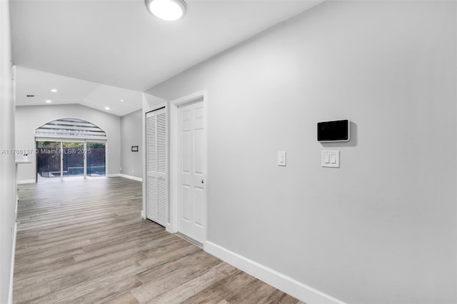 8612 SW 159th Pl, Miami, FL 33193 - hall with wood finished floors, recessed lighting, arched walkways, and lofted ceiling