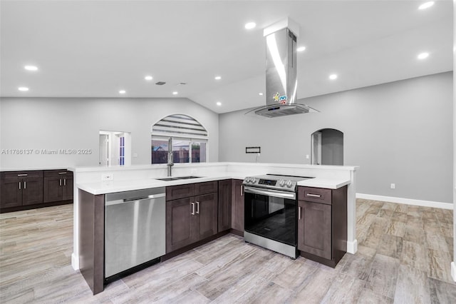 8612 SW 159th Pl, Miami, FL 33193 - kitchen featuring appliances with stainless steel finishes, island exhaust hood, dark brown cabinetry, light countertops, and vaulted ceiling