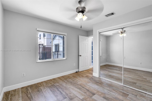 8612 SW 159th Pl, Miami, FL 33193 - unfurnished bedroom with wood finished floors, a closet, and ceiling fan