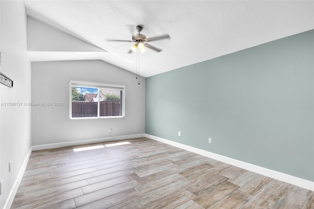 8612 SW 159th Pl, Miami, FL 33193 - spare room featuring a ceiling fan, lofted ceiling, and wood finished floors