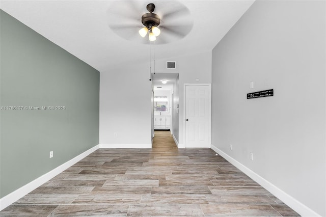 8612 SW 159th Pl, Miami, FL 33193 - empty room featuring vaulted ceiling, ceiling fan, and wood finished floors