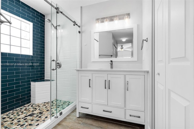 8612 SW 159th Pl, Miami, FL 33193 - bathroom with a shower stall, vanity, a ceiling fan, wood finished floors, and a closet