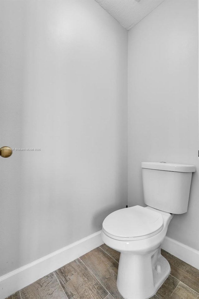 8612 SW 159th Pl, Miami, FL 33193 - bathroom with wood finished floors and a textured ceiling