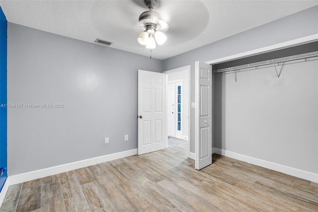 8612 SW 159th Pl, Miami, FL 33193 - unfurnished bedroom featuring wood finished floors, a closet, and a ceiling fan