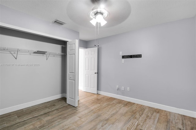 8612 SW 159th Pl, Miami, FL 33193 - unfurnished bedroom with wood finished floors, a closet, and a ceiling fan