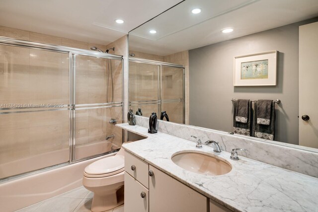 1121 Crandon Blvd Unit F206, Key Biscayne, FL 33149 - full bathroom with toilet, recessed lighting, tile patterned flooring, combined bath / shower with glass door, and vanity