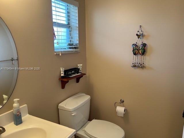 half bath with toilet and vanity