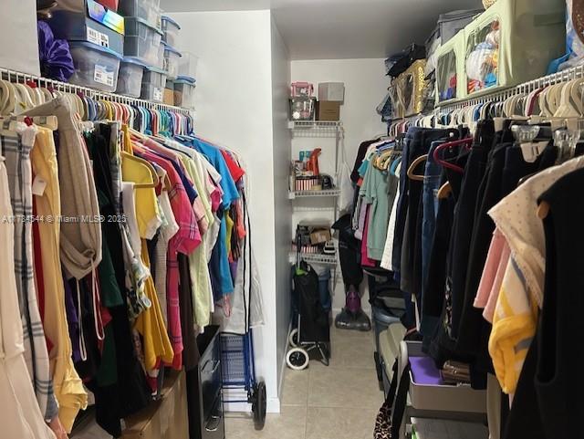 spacious closet with tile patterned flooring