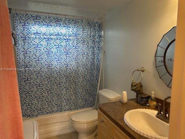 full bathroom with toilet, vanity, tile patterned floors, and shower / bath combo with shower curtain
