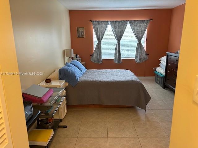 bedroom with tile patterned flooring
