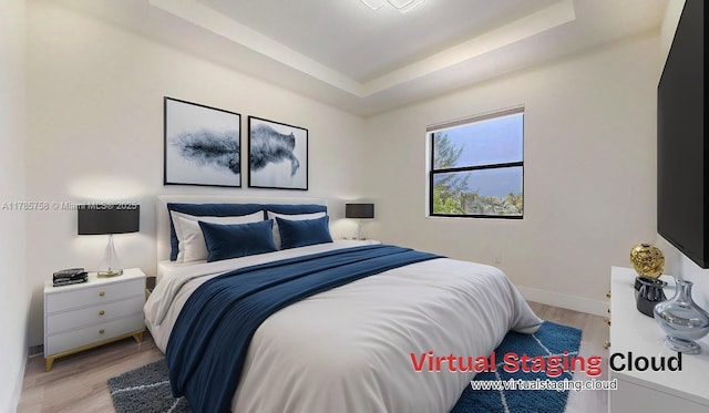 9231 W 32nd Ln, Hialeah, FL 33018 - bedroom featuring a raised ceiling and wood finished floors
