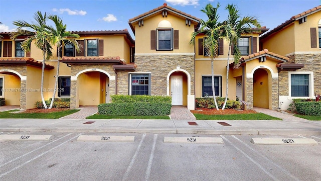 9231 W 32nd Ln, Hialeah, FL 33018 - view of front of house with stone siding, stucco siding, and uncovered parking