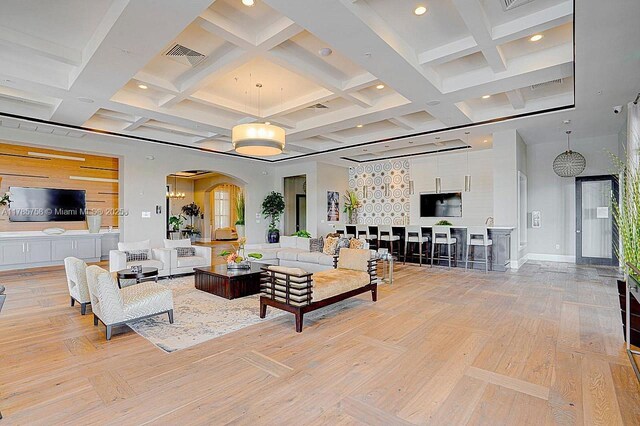 9231 W 32nd Ln, Hialeah, FL 33018 - living room with arched walkways, light wood finished floors, beamed ceiling, recessed lighting, and coffered ceiling