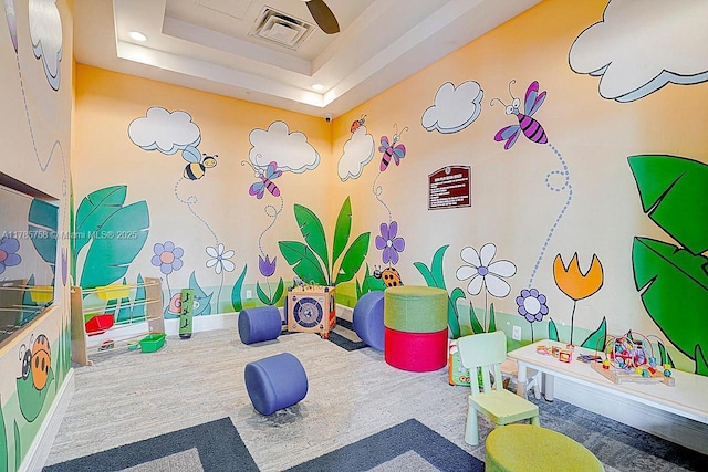 9231 W 32nd Ln, Hialeah, FL 33018 - playroom featuring a raised ceiling and carpet floors