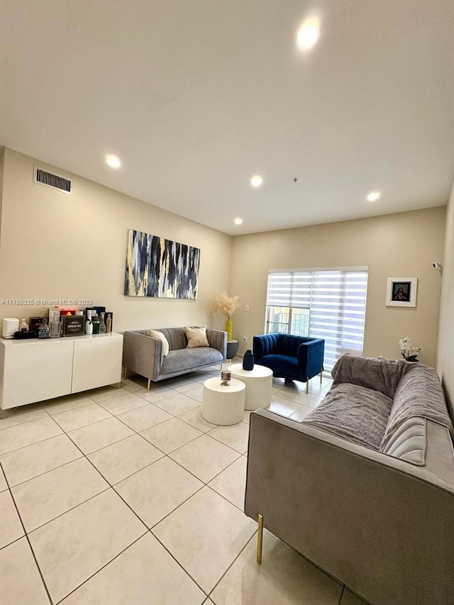 living area featuring visible vents, recessed lighting, and light tile patterned flooring