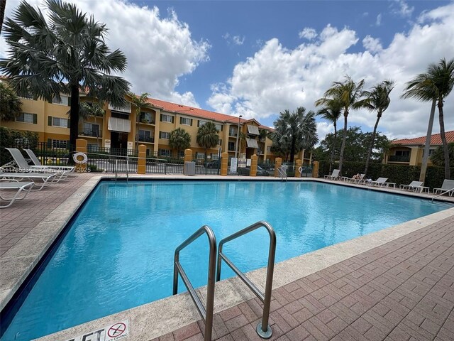 7340 NW 114th Ave Unit 201, Doral, FL 33178 - community pool featuring fence and a patio area