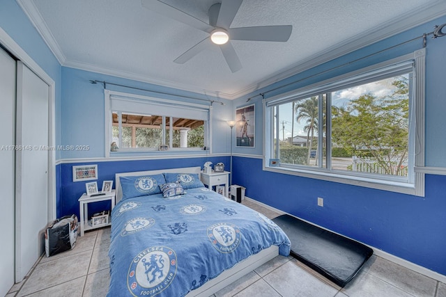 7215 SW 16th St, Miami, FL 33155 - tiled bedroom with a textured ceiling, crown molding, a ceiling fan, and baseboards