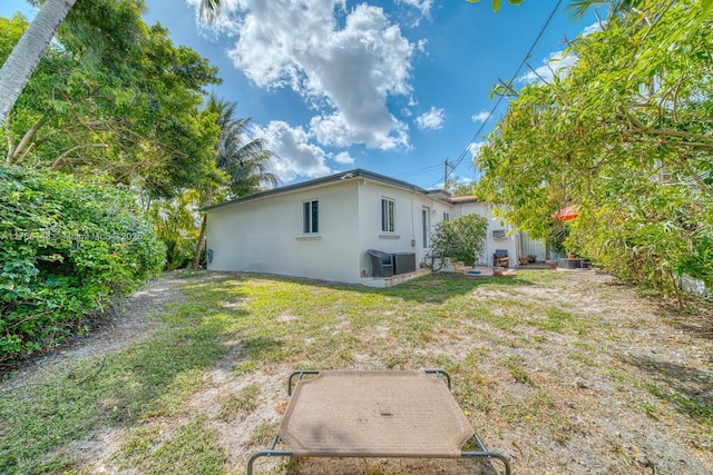 7215 SW 16th St, Miami, FL 33155 - rear view of house with a patio, stucco siding, and central AC