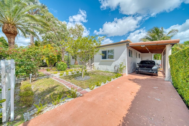 7215 SW 16th St, Miami, FL 33155 - manufactured / mobile home featuring a carport, stucco siding, and driveway
