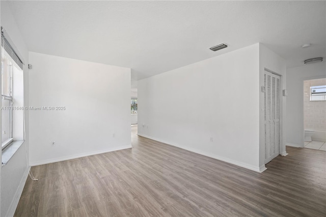 244 NW 179th St, Miami Gardens, FL 33169 - unfurnished room with baseboards, wood finished floors, and visible vents