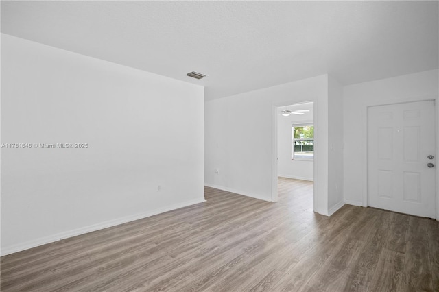 244 NW 179th St, Miami Gardens, FL 33169 - empty room featuring wood finished floors, visible vents, and baseboards