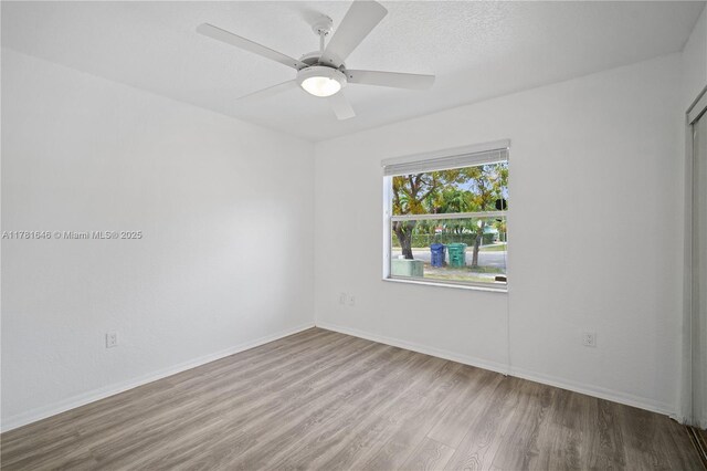 244 NW 179th St, Miami Gardens, FL 33169 - spare room featuring ceiling fan, baseboards, and wood finished floors