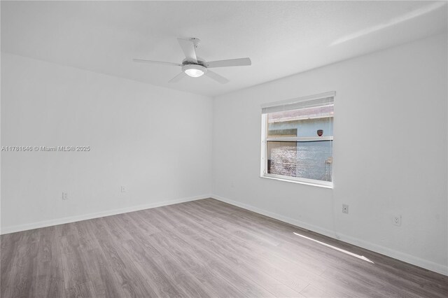 244 NW 179th St, Miami Gardens, FL 33169 - unfurnished room with baseboards, a ceiling fan, and wood finished floors