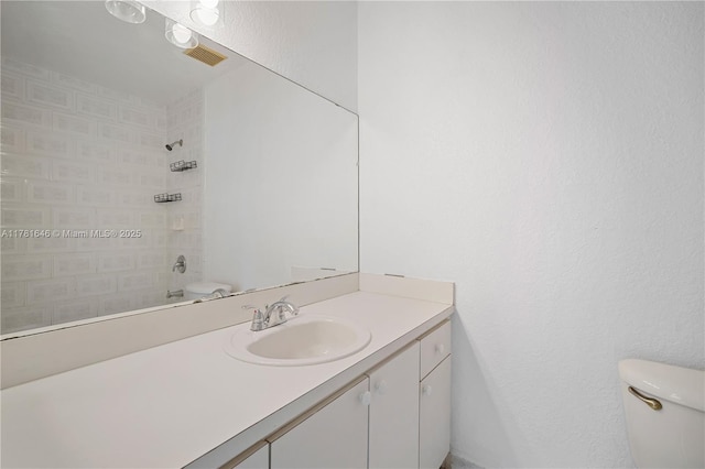244 NW 179th St, Miami Gardens, FL 33169 - full bath with toilet, vanity, visible vents, and tiled shower