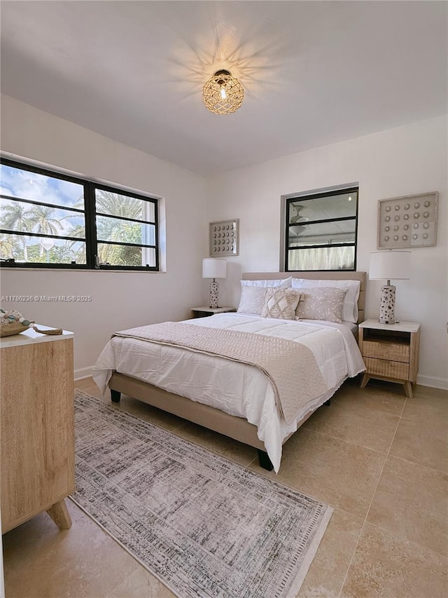 bedroom featuring baseboards