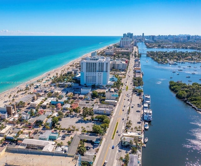 bird's eye view with a view of city, a water view, and a beach view
