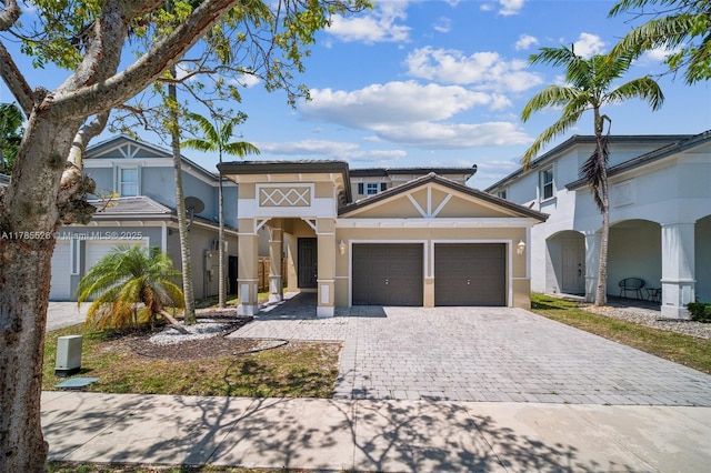 146 NE 36th Ter, Homestead, FL 33033 - mediterranean / spanish-style home featuring stucco siding, an attached garage, and decorative driveway