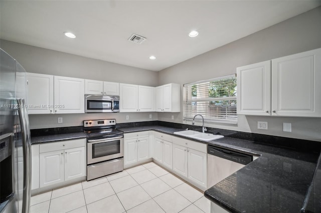 146 NE 36th Ter, Homestead, FL 33033 - kitchen with white cabinetry, appliances with stainless steel finishes, a sink, and visible vents