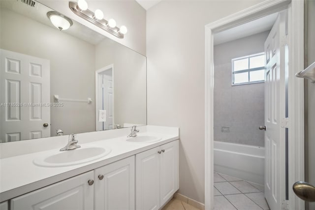 146 NE 36th Ter, Homestead, FL 33033 - full bath featuring visible vents, tile patterned flooring, a sink, and double vanity