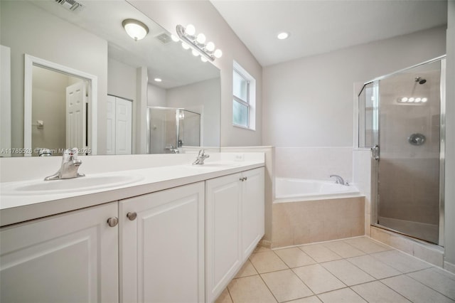 146 NE 36th Ter, Homestead, FL 33033 - full bath with tile patterned floors, visible vents, a sink, a garden tub, and a stall shower