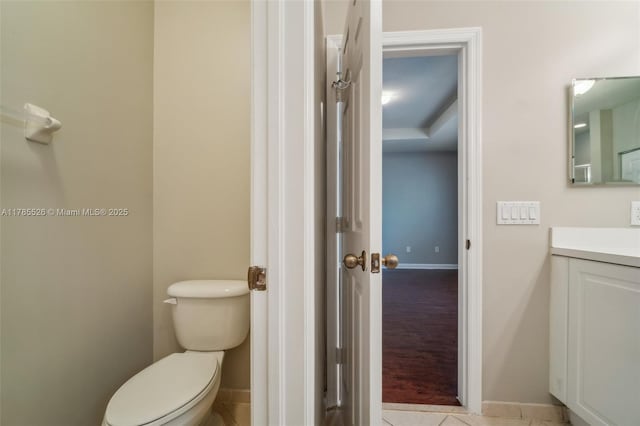 146 NE 36th Ter, Homestead, FL 33033 - half bathroom featuring baseboards, toilet, and vanity