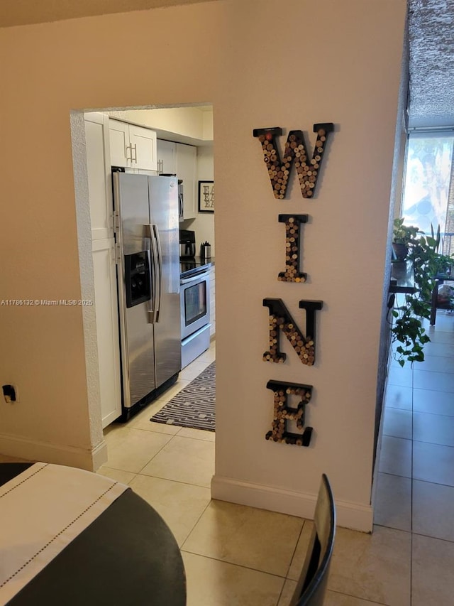 9411 SW 4th St Unit 203, Miami, FL 33174 - hallway featuring baseboards and light tile patterned floors