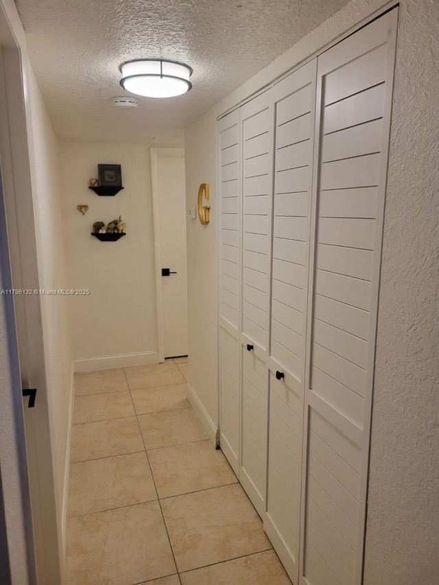 9411 SW 4th St Unit 203, Miami, FL 33174 - hall featuring a textured ceiling and light tile patterned flooring