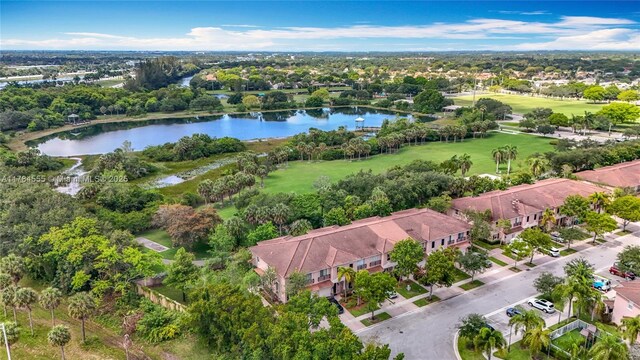 294 Las Brisas Cir, Sunrise, FL 33326 - aerial view of residential area featuring a large body of water, a local golf course, and a tree filled landscape