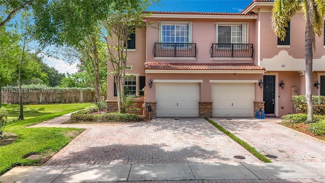 294 Las Brisas Cir, Sunrise, FL 33326 - view of front of property featuring stucco siding, decorative driveway, a tile roof, an attached garage, and stone siding