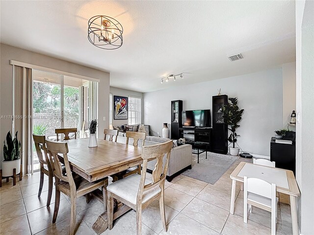294 Las Brisas Cir, Sunrise, FL 33326 - dining area featuring light tile patterned floors and a chandelier