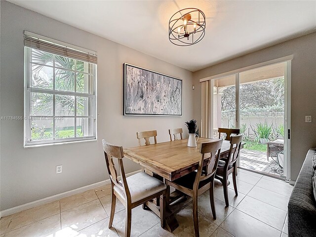 294 Las Brisas Cir, Sunrise, FL 33326 - dining room featuring a chandelier, baseboards, and light tile patterned flooring