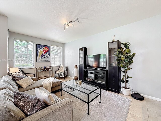 294 Las Brisas Cir, Sunrise, FL 33326 - tiled living room with baseboards and a textured ceiling