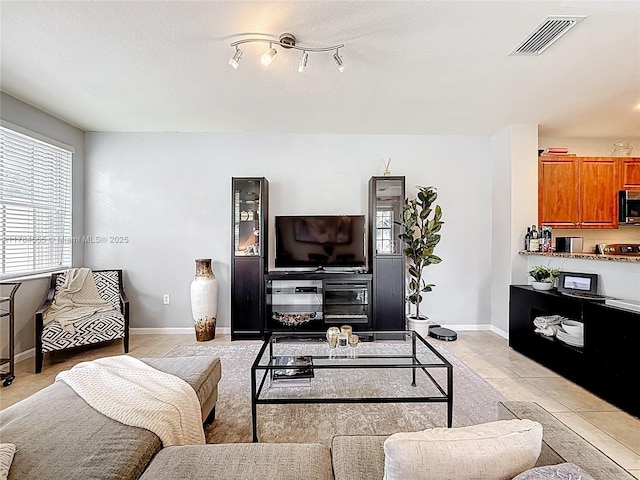 294 Las Brisas Cir, Sunrise, FL 33326 - living room featuring baseboards and light tile patterned flooring